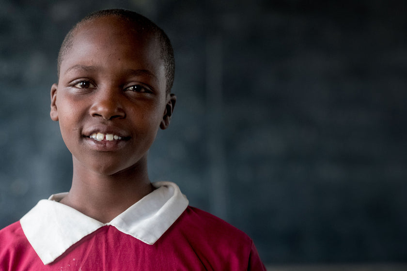 Your gifts will transform lives, like this girl who is in school because of you.