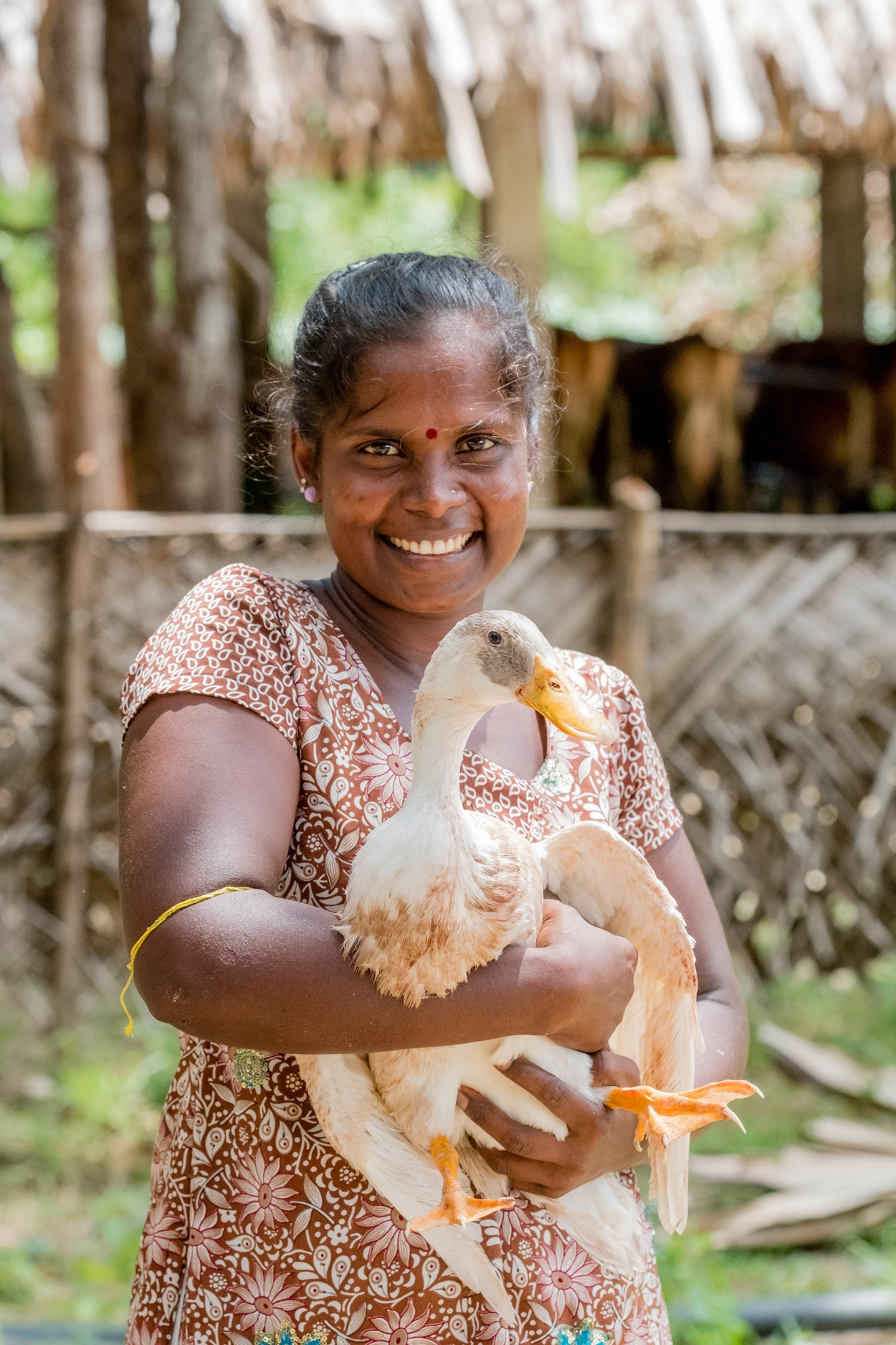woman holding a duckling